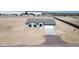 Single-story home featuring a gray stucco exterior, a gray roof, and an attached two-car garage at 6250 S Dean Rd, Buckeye, AZ 85326