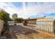 Fenced backyard with a shed, decorative plants, and an outdoor storage space at 6331 W Eva St, Glendale, AZ 85302