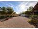 Expansive backyard with mature trees, decorative landscaping and a gravel ground cover at 6331 W Eva St, Glendale, AZ 85302