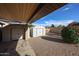 Backyard featuring two storage sheds, a large gravel area, and colorful landscaping at 6331 W Eva St, Glendale, AZ 85302