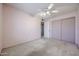 Bedroom with a ceiling fan, closet, and standard window at 6331 W Eva St, Glendale, AZ 85302