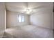 Bedroom featuring carpet flooring, a ceiling fan, and a window for natural light at 6331 W Eva St, Glendale, AZ 85302