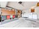 Well-equipped garage featuring a workbench, laundry area, and ample storage cabinets at 6331 W Eva St, Glendale, AZ 85302