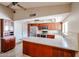 Well-appointed kitchen featuring stainless steel appliances and solid surface countertops at 6331 W Eva St, Glendale, AZ 85302