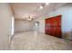 Open-concept living room with tile flooring and a built-in cabinet at 6331 W Eva St, Glendale, AZ 85302