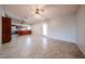 Bright, open living area with tile flooring and a view into the updated kitchen at 6331 W Eva St, Glendale, AZ 85302