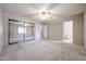 Bedroom with a closet, ceiling fan, and view into the bathroom at 6331 W Eva St, Glendale, AZ 85302