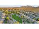 Neighborhood aerial view with park, homes, and mountain views in the background at 6993 S Ruby Dr, Chandler, AZ 85249