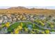Panoramic aerial of a neighborhood featuring a community park and desert mountain views at 6993 S Ruby Dr, Chandler, AZ 85249