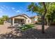 Backyard with a covered patio, artificial lawn, and low-maintenance landscaping at 6993 S Ruby Dr, Chandler, AZ 85249