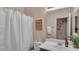 Bright bathroom with a shower and a decorative 'Bathroom Rules' sign at 6993 S Ruby Dr, Chandler, AZ 85249