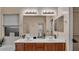 Bathroom featuring a double sink vanity, a large mirror, and a window for natural light at 6993 S Ruby Dr, Chandler, AZ 85249
