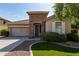 Charming single-story home with a stone-accented entry and well-manicured landscaping at 6993 S Ruby Dr, Chandler, AZ 85249