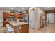 Well-lit kitchen with stainless steel appliances, an island with a breakfast bar and ample cabinet space at 6993 S Ruby Dr, Chandler, AZ 85249
