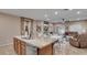 Open-concept kitchen and living area featuring a large island and stainless steel appliances at 6993 S Ruby Dr, Chandler, AZ 85249