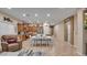 Open concept living room showcasing stylish furnishings, a dining area, and an adjacent kitchen, ideal for Gathering gatherings at 6993 S Ruby Dr, Chandler, AZ 85249