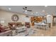 Open concept living room showcasing stylish furnishings, a dining area, and an adjacent kitchen, ideal for Gathering gatherings at 6993 S Ruby Dr, Chandler, AZ 85249