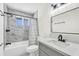 Modern bathroom featuring a shower, tub, and sleek vanity at 7745 N 33Rd Ave, Phoenix, AZ 85051