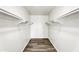 Walk-in closet with hardwood floors and shelving at 7745 N 33Rd Ave, Phoenix, AZ 85051