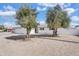 Single-story home featuring a white exterior, gravel landscaping, and a two-car garage at 7745 N 33Rd Ave, Phoenix, AZ 85051