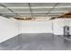 Spacious garage showcasing a sealed floor, water heater, with ample room for parking and storage at 7745 N 33Rd Ave, Phoenix, AZ 85051