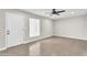 Bright living room with tile flooring, a ceiling fan, and a neutral color scheme at 7745 N 33Rd Ave, Phoenix, AZ 85051