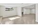 Bright living room with tile flooring and an open floor plan leading to the kitchen at 7745 N 33Rd Ave, Phoenix, AZ 85051