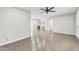 Spacious living room with tile flooring, a ceiling fan, and an open floor plan at 7745 N 33Rd Ave, Phoenix, AZ 85051