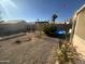 Backyard with gravel featuring sparse landscaping and outdoor string lights at 8863 W Greer Ave, Peoria, AZ 85345