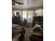 Bedroom featuring a bed, multiple dark wooden dressers, and natural light coming through a large window at 8863 W Greer Ave, Peoria, AZ 85345