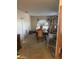 A furnished formal dining room with carpet flooring and natural light at 8863 W Greer Ave, Peoria, AZ 85345