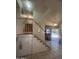 Bright entryway features tile flooring, staircase with white banister, and a view to the front door and exterior at 8863 W Greer Ave, Peoria, AZ 85345