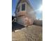 Beige home featuring an attached two-car garage and desert landscaping at 8863 W Greer Ave, Peoria, AZ 85345