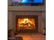 Inviting fireplace featuring a tiled hearth and surround, perfect for cozy evenings at home at 8863 W Greer Ave, Peoria, AZ 85345