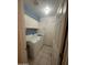 Functional laundry room with white cabinets, washer, dryer, and tile flooring for easy maintenance at 8863 W Greer Ave, Peoria, AZ 85345