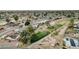 Aerial view of a golf course and residential neighborhood with mature trees and desert landscaping at 915 S Saranac Ave, Mesa, AZ 85208