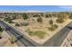 Birds eye view of a park near a neighborhood, featuring green space, mature trees, and a covered picnic area at 915 S Saranac Ave, Mesa, AZ 85208
