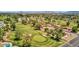Golf community with lush green fairways and mountain views at 915 S Saranac Ave, Mesa, AZ 85208