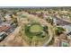 Expansive aerial view of a golf course with mature trees and surrounding residential neighborhood at 915 S Saranac Ave, Mesa, AZ 85208