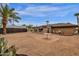 Large backyard with gravel and patios, offering outdoor relaxation and entertainment space at 915 S Saranac Ave, Mesa, AZ 85208