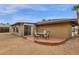 Backyard patio with table and chairs perfect for outdoor entertaining and relaxation at 915 S Saranac Ave, Mesa, AZ 85208