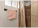 Bathroom showing a shower with tiled walls, a glass door and a towel rack at 915 S Saranac Ave, Mesa, AZ 85208