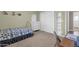 Serene bedroom with a single bed, closet, and natural lighting from the window at 915 S Saranac Ave, Mesa, AZ 85208