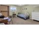 Comfortable bedroom with a single bed, desk, and natural light from the window at 915 S Saranac Ave, Mesa, AZ 85208