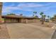 Inviting home with a spacious covered carport and desert landscaping at 915 S Saranac Ave, Mesa, AZ 85208