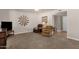Cozy living room featuring plush carpeting and comfortable seating at 915 S Saranac Ave, Mesa, AZ 85208