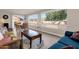Open-concept living room with natural light, views of the backyard, and ample seating at 915 S Saranac Ave, Mesa, AZ 85208