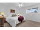 Comfortable bedroom featuring a ceiling fan, and a plush bed with accent pillows at 915 S Saranac Ave, Mesa, AZ 85208