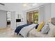 Bright and sunny bedroom boasts ensuite bath, private balcony, and queen bed at 9708 E Via Linda -- # 2328, Scottsdale, AZ 85258