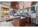 Clubhouse kitchen with granite countertops, wooden cabinets, refreshment center, and natural light at 9708 E Via Linda -- # 2328, Scottsdale, AZ 85258
